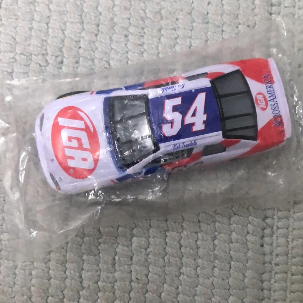 NASCAR die cast toy Monte Carlo Jason Keller #54 car featuring IGA logo. Vintage